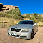2011 BMW 3 Series 328i in Titanium Silver with Black Leather, parked outdoors in Colorado.