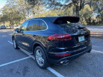 2015 Porsche Cayenne S AWD parked with panoramic roof and stylish design, showcasing excellent condition with low mileage
