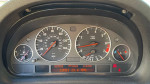 Instrument cluster of a 2006 BMW X5 3.0i showing speed, fuel, and mileage readings.