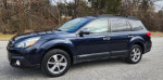 2014 Subaru Outback 2.5i Limited AWD SUV in Deep Indigo Pearl parked in a scenic area