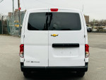 Rear view of a 2015 Chevrolet City Express LS cargo van in clean condition, parked in a commercial area.