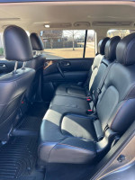Interior view of a 2019 Nissan Armada SL showing comfortable leather seats and spacious rear cabin