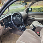 Interior view of a 2015 Toyota 4Runner with manual transmission and clean upholstery.