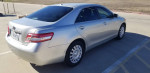 2010 Toyota Camry in excellent condition, with low mileage and reliable performance, parked on a lot.