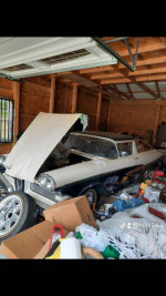 1958 Ford Edsel Ranchero in a cluttered garage, showcasing its classic design and unique modifications.