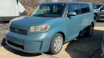 2010 Scion xB in good mechanical condition, displaying a salvaged title and signs of paint wear.
