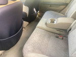 Interior view of a well-maintained 2006 Honda CR-V LX with clean back seats and armrest.