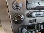 Interior controls of a 2011 Nissan Armada 4X4, featuring tow mode and climate settings