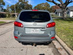 Rear view of a well-maintained 2009 Hyundai Santa Fe GLS FWD parked on a residential street.