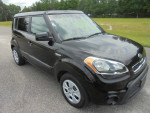 2013 Kia Soul Sport SUV in black, showcasing its clean exterior and modern design, ready for a confident drive.