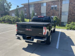 2018 GMC Canyon SLE 4WD truck with 51,000 miles, excellent condition, in a parking lot.