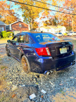 2013 Subaru Impreza WRX with performance upgrades and new tires parked outdoors