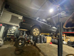 1997 Toyota Tercel on a lift in a garage, showcasing its reliability and recent maintenance.