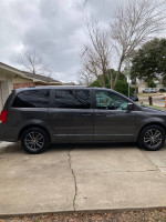 2017 Dodge Grand Caravan parked, featuring dual sliding doors, reliable family van, and clean Texas title.