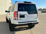 2013 Land Rover LR4 HSE Luxury with 71,000 miles showcased from the rear, featuring a clean design and robust tires.