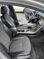 Interior view of a 2013 Chevrolet Malibu Eco FWD with two front seats and center console