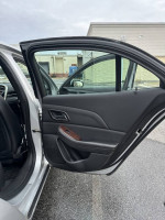 Interior side view of 2013 Chevrolet Malibu Eco FWD door, showcasing features and condition.