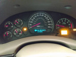 Dashboard display of a 1999 Chevrolet Blazer showing speed, fuel, and temperature gauges.