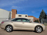 Side view of a 2008 Toyota Camry LE in excellent condition, showcasing clean design and good maintenance.