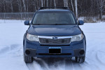 Front view of a well-maintained 2010 Subaru Forester 2.5X AWD in snow, showcasing its features and condition.