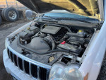 Engine view of a 2007 Jeep Grand Cherokee with maintenance details for potential buyers.