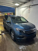 2017 Honda Pilot EX-L in blue, parked, featuring leather seats and sunroof, with 101,000 miles.