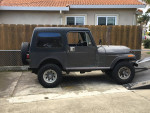 1985 Jeep CJ7 Renegade in original gray color, showcasing its vintage design and low mileage.