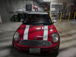 Front view of a red Mini Cooper with a clean title, featuring premium features and recent maintenance.