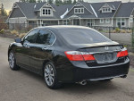 2015 Honda Accord Sport in black color parked on a residential street, showcasing its sleek design and clean exterior.