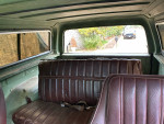 Interior view of a 1984 Chevrolet Blazer with brown seating and spacious layout