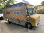 Fully-equipped 1997 Chevy P30 catering food truck with industrial refrigerators and stainless steel sinks.