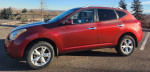 2011 Nissan Rogue SL AWD in red with maintenance records and new transmission for sale