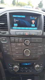 Dashboard of a 2013 Buick Regal GS with infotainment system and climate controls