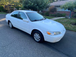 1999 Toyota Camry CE in white, 135,000 miles, with new timing belt and great fuel economy.