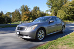 2009 Infiniti G37 Sport Sedan in a park, showcasing its sleek design and alloy wheels