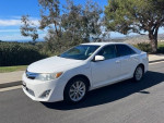 2013 Toyota Camry XLE in excellent condition, white exterior, 133,700 miles, with convenience features and clean title.