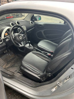 Interior of 2016 Smart Fortwo Pure with leather seats, navigation, and Apple Carplay features.