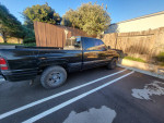 1998 Dodge Ram 1500 truck parked, showing wear and scratches, located in Lompoc, CA.