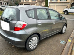 2013 Honda Fit with grey exterior and interior, 80,000 miles, fuel-efficient 1.5L engine, running perfectly.