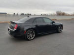 2017 Chrysler 300 S in black, showcasing sleek design and new engine oil cooler upgrade, parked in an empty lot.
