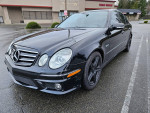 2008 E63 AMG in mint condition, featuring performance package and luxurious design, parked outdoors