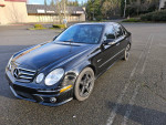 2008 E63 AMG in mint condition, showcasing its sleek design and performance package on a sunny day.