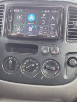 Interior view of a 2002 Ford Escape showing the audio system and climate controls.