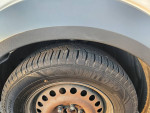 Close-up of a Sumitomo tire on a vehicle, ideal for contractors or personal use, showcasing tread and durability.
