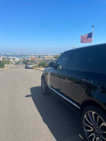 Side view of a luxurious Land Rover Range Rover Autobiography, showcasing its sleek design and shiny wheels.