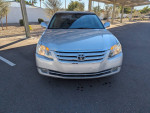 2006 Toyota Avalon XLS FWD with 67,000 miles, silver exterior, in clean condition with power features and sunroof.