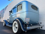 1930 Plymouth Sedan Hot Rod in blue color, showcasing vintage style with new wheels and custom sound system.