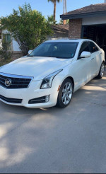 2013 Cadillac ATS Performance RWD in white, showcasing clean design and excellent condition with 79,000 miles.