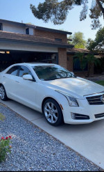 2013 Cadillac ATS Performance RWD in white, showcasing sleek design and excellent condition, parked in driveway.