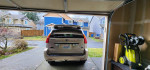 2004 Lexus GX 470 4WD parked in garage, showcasing its clean exterior and vibrant surroundings.